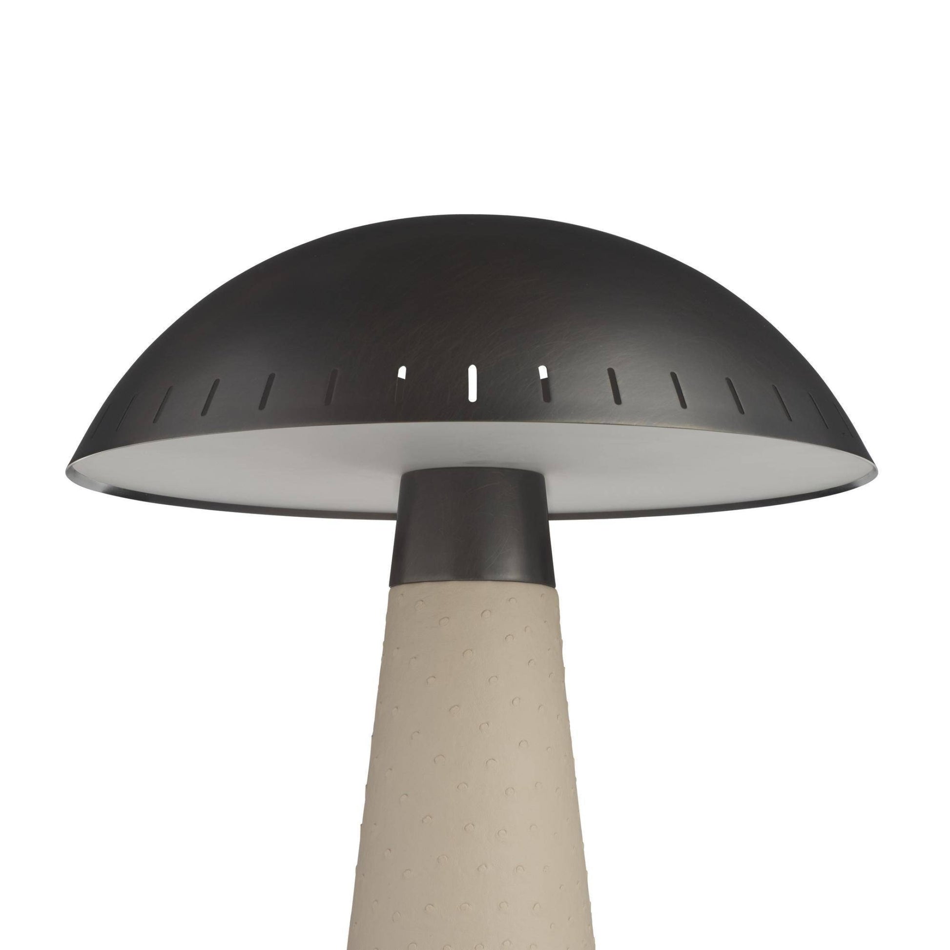 Decorative lamp with a black shade and beige base on a white background