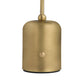 Gold table lamp with white glass shade on a white background