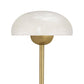 Gold table lamp with white glass shade on a white background