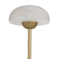 Gold table lamp with white glass shade on a white background