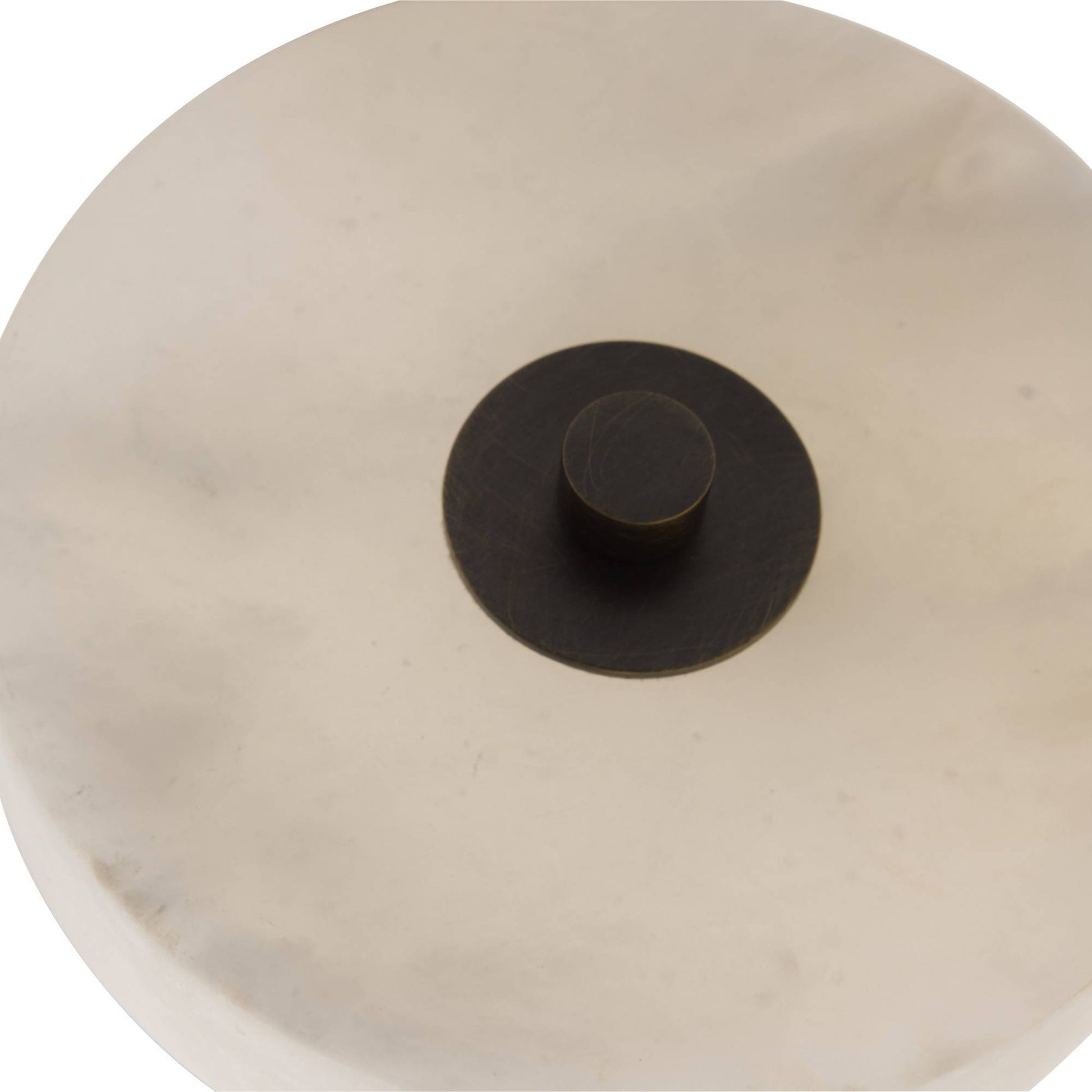 Round beige ceramic pot with a black lid on a white background