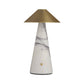A modern table lamp with a tapered white marble base featuring gray veining, a brushed brass conical shade, and a small round brass accent on the front.