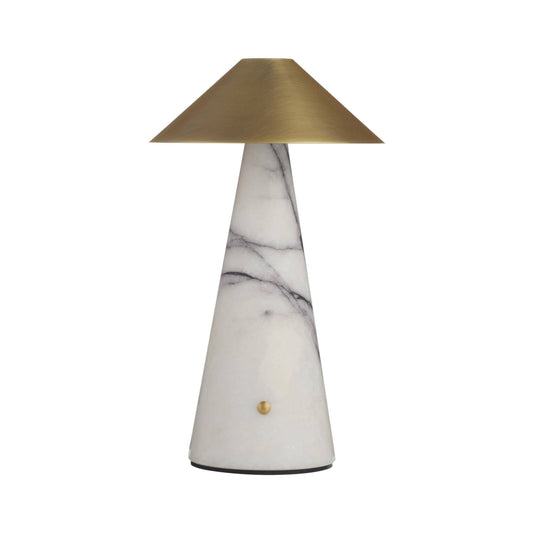 A modern table lamp with a tapered white marble base featuring gray veining, a brushed brass conical shade, and a small round brass accent on the front.