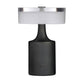 Table lamp with black base and white shade on a white background