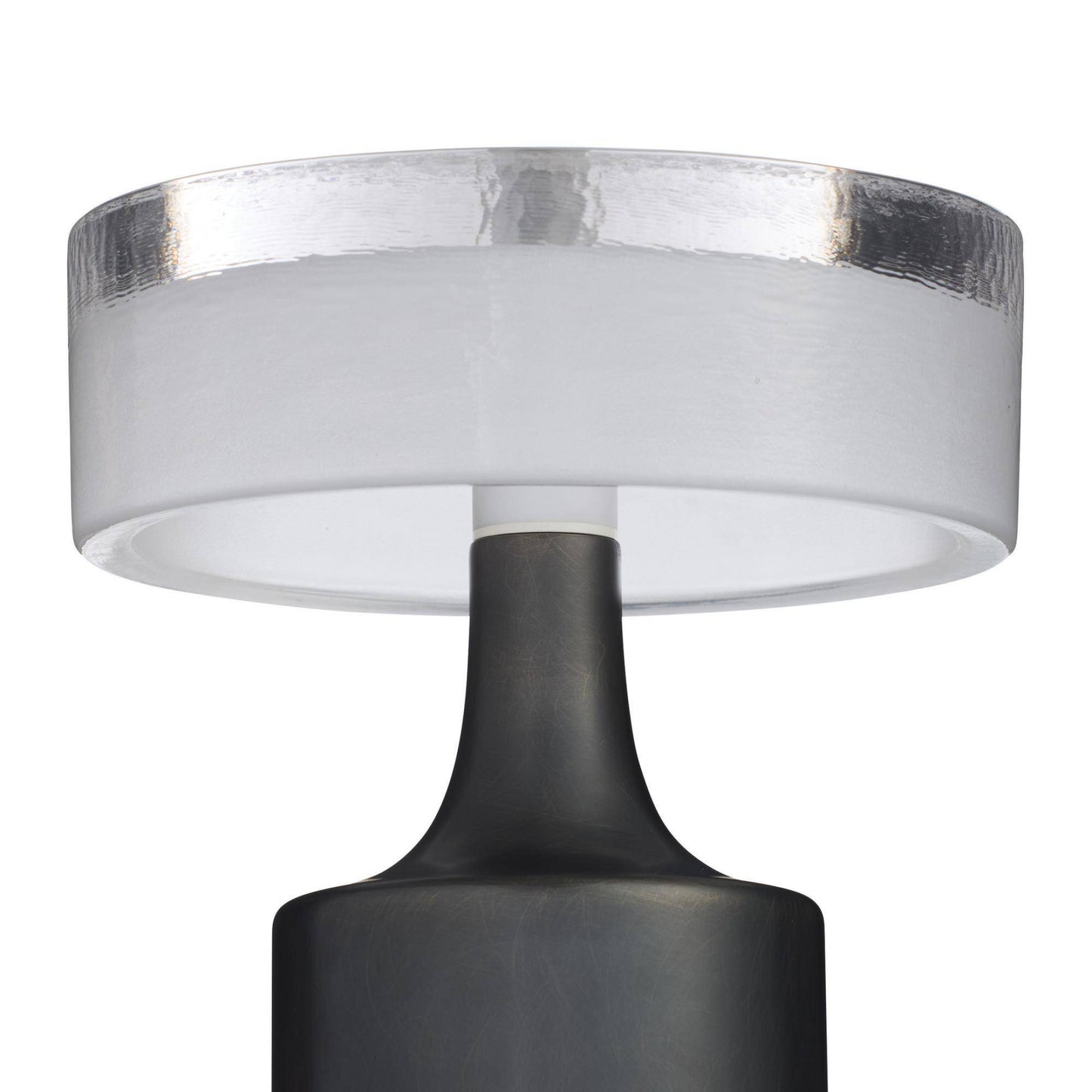 Close-up of a lamp with a white shade and black base on a white background