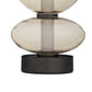 Decorative lamp with glass shades and bronze base on a white background