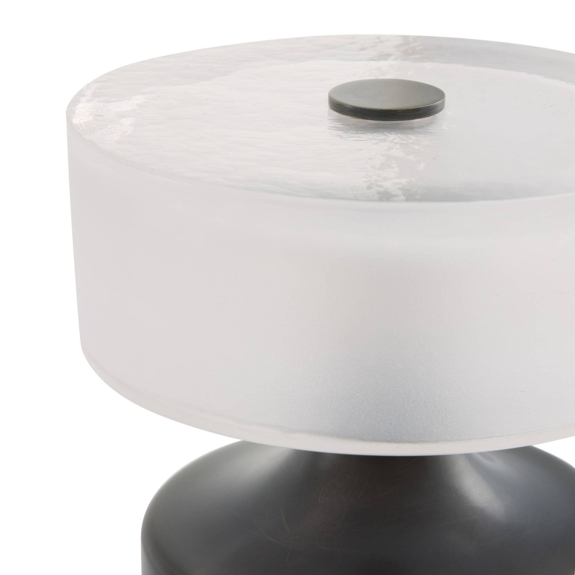 Round table with white top and black base on a white background