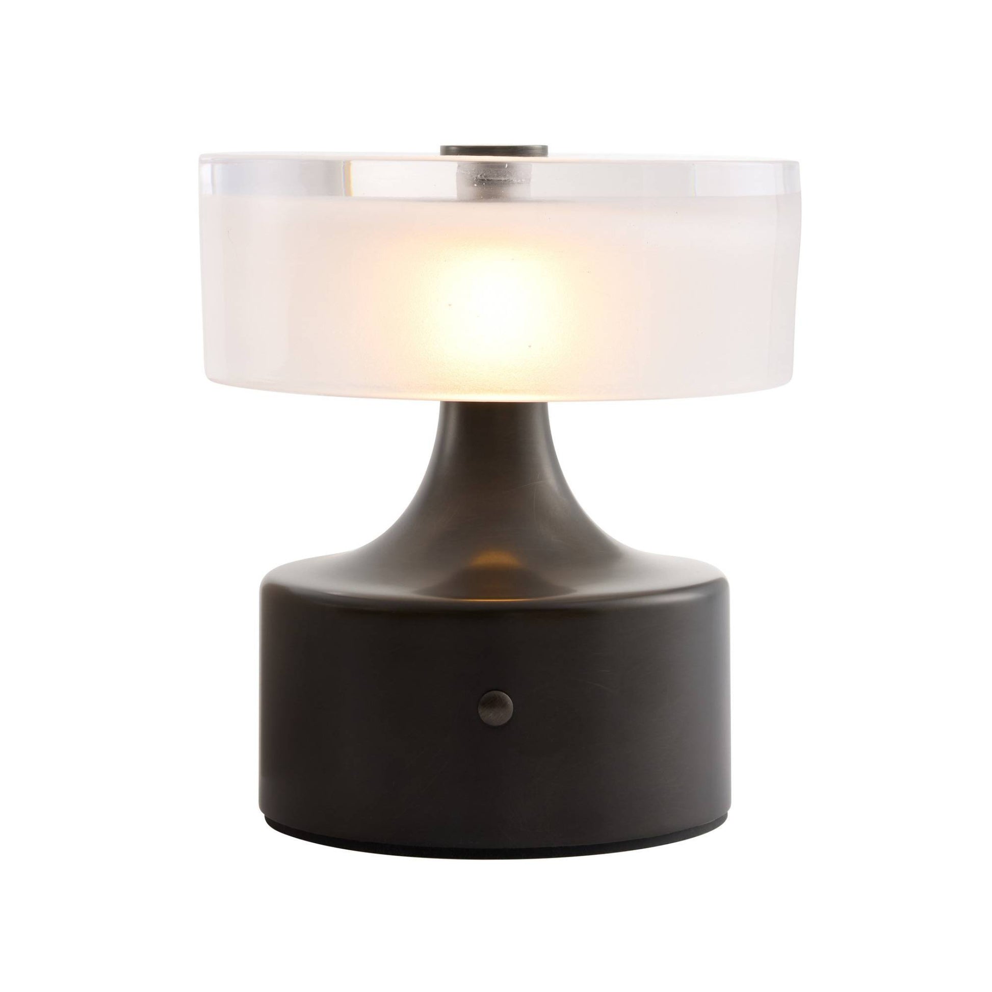 Table lamp with a white shade and dark base on a white background