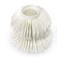 White synthetic hair replacement product on a white background