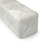 Rectangular woven pillow with a geometric pattern on a white background
