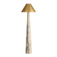Floor lamp with marble base and gold shade on a white background