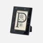 Black decorative frame with a letter 'P' design on a white background
