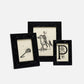 Three black-framed pictures with different designs on a white background