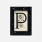 Decorative letter 'P' in a black frame on a white background