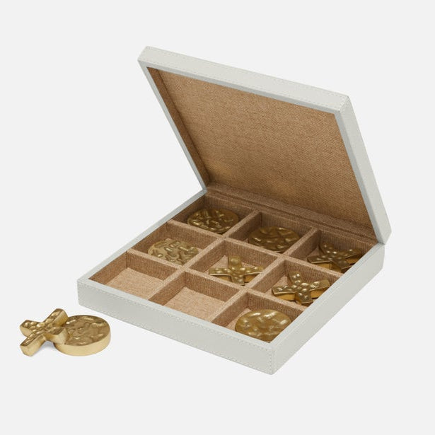 Open jewelry box with compartments containing gold coins on a white background