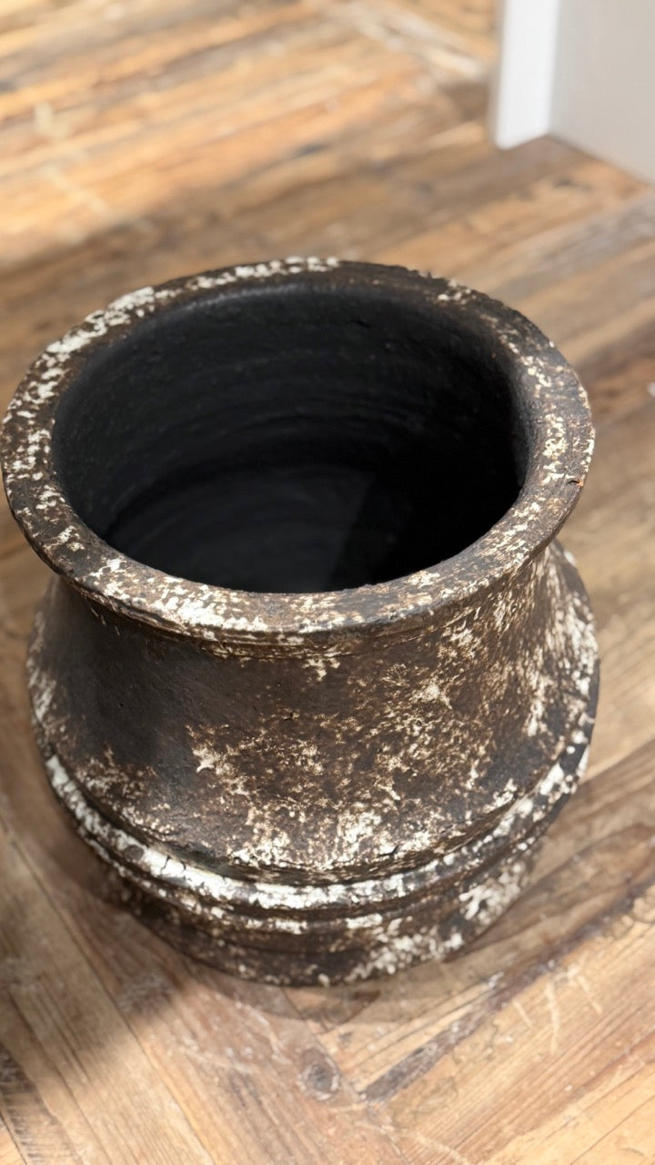 Decorative pot on a wooden floor