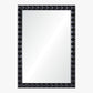 Rectangular mirror with a black, pyramid-patterned frame on a white background