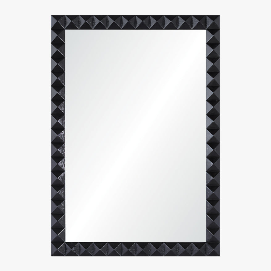 Rectangular mirror with a black, pyramid-patterned frame on a white background