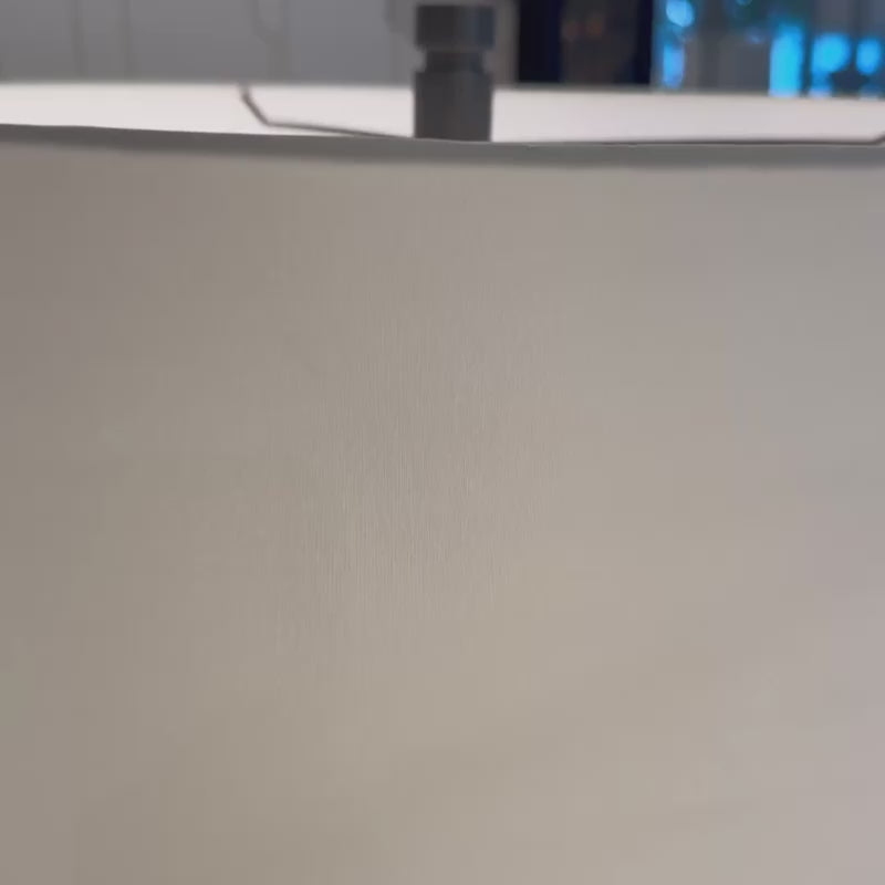 ivory fringe table lamp in a showroom