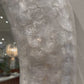 capiz shell white round mirror in a showroom