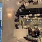 video of a showroom showcasing a wooden bead large round mirror