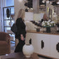 video of a showroom showcasing a wooden bead large round mirror