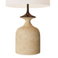 Beige ceramic table lamp with a white shade on a white background