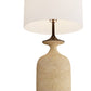 Table lamp with beige base and white shade on a white background