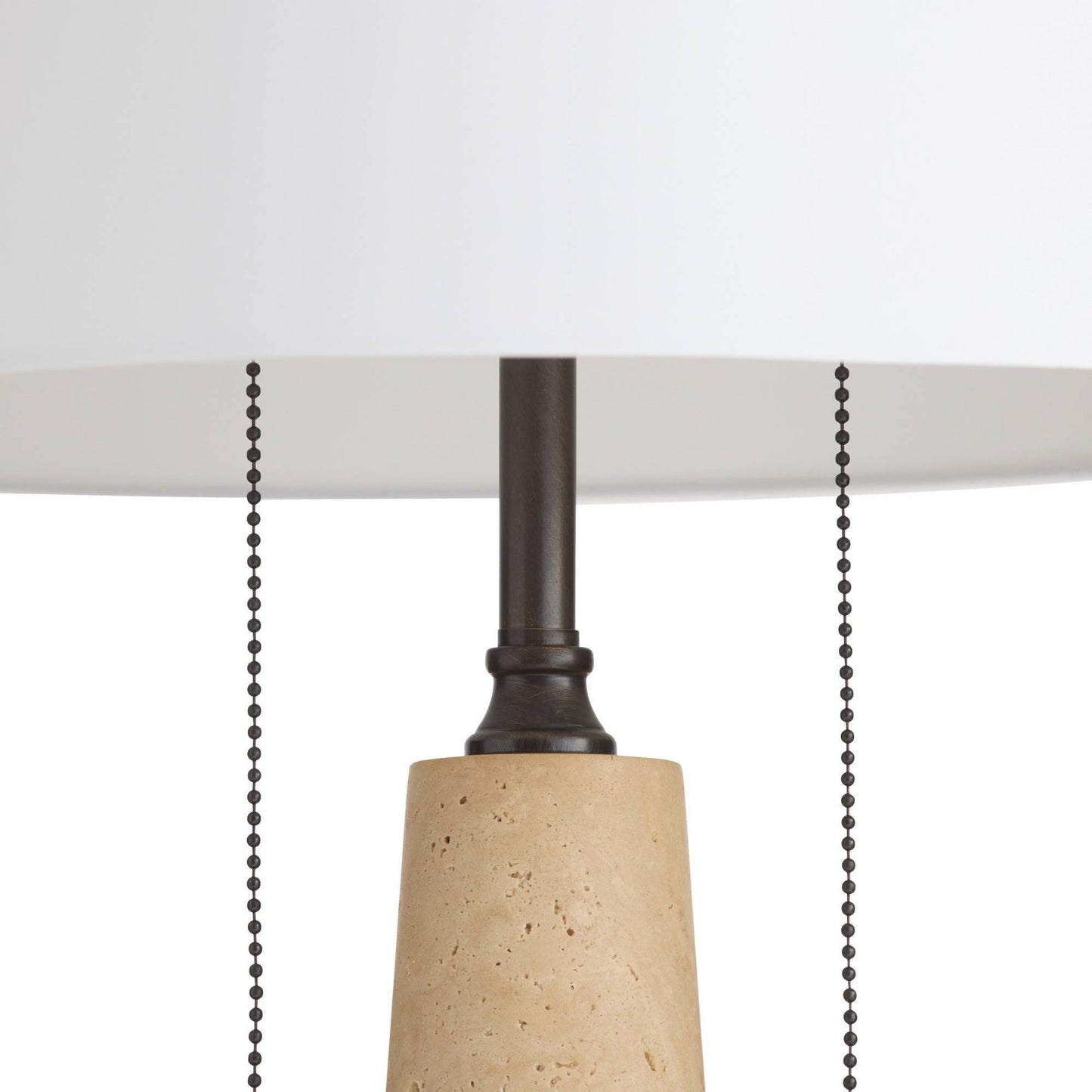 Close-up of a pendant light with a concrete base and black pull chain on a white background
