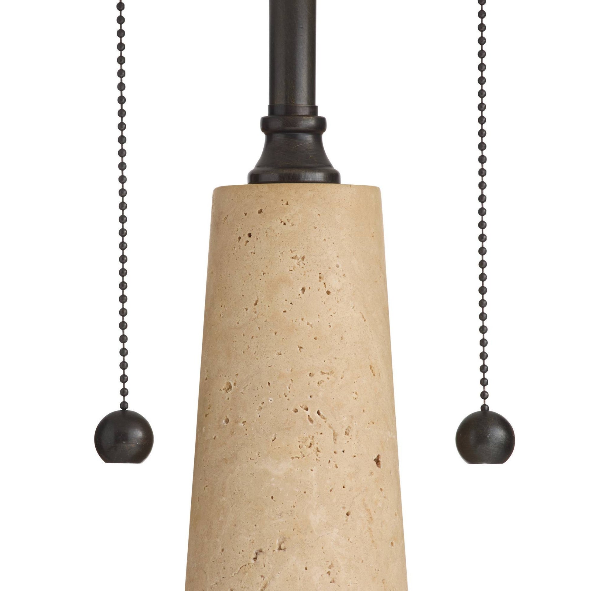 A close-up of a modern pendant light fixture showing a tapered beige travertine stone shade, a dark bronze metal canopy, and two matching dark pull chains with spherical weights on a white background.