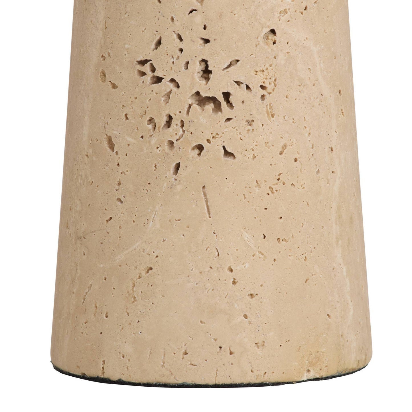 Close-up of a textured beige stone object on a white background