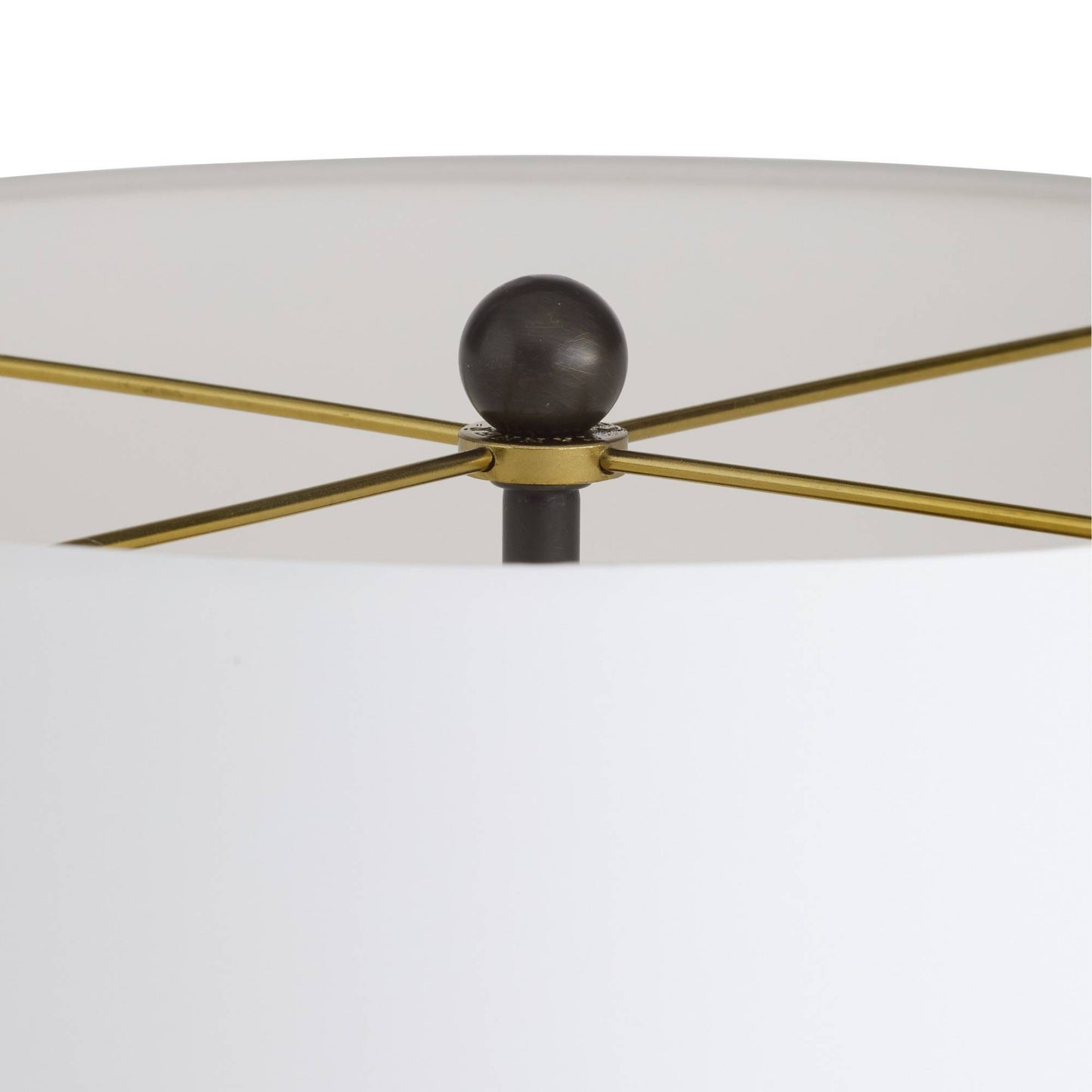 Close-up of a ceiling fan with gold blades and black central hub on a white background