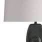 Table lamp with a gray shade and black base on a white background