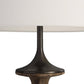 Close-up of a table lamp with a dark bronze base and white shade on a white background