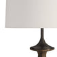 Table lamp with a white shade and dark brown base on a white background