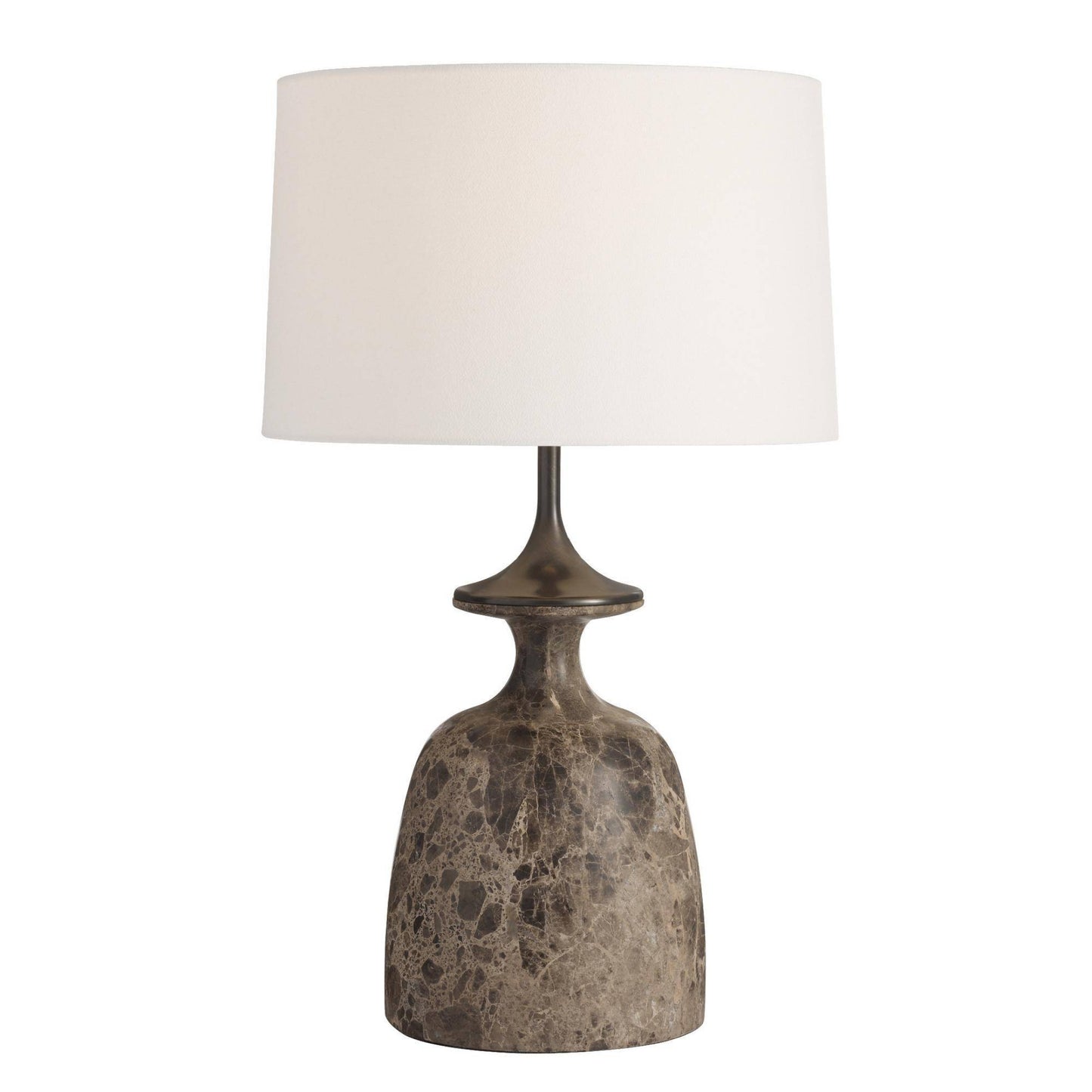 Table lamp with a textured base and white shade on a white background