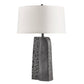 A modern table lamp with a textured dark gray stone base and a large white drum shade, shown against a plain white background.