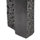 Textured black stone block with a white background