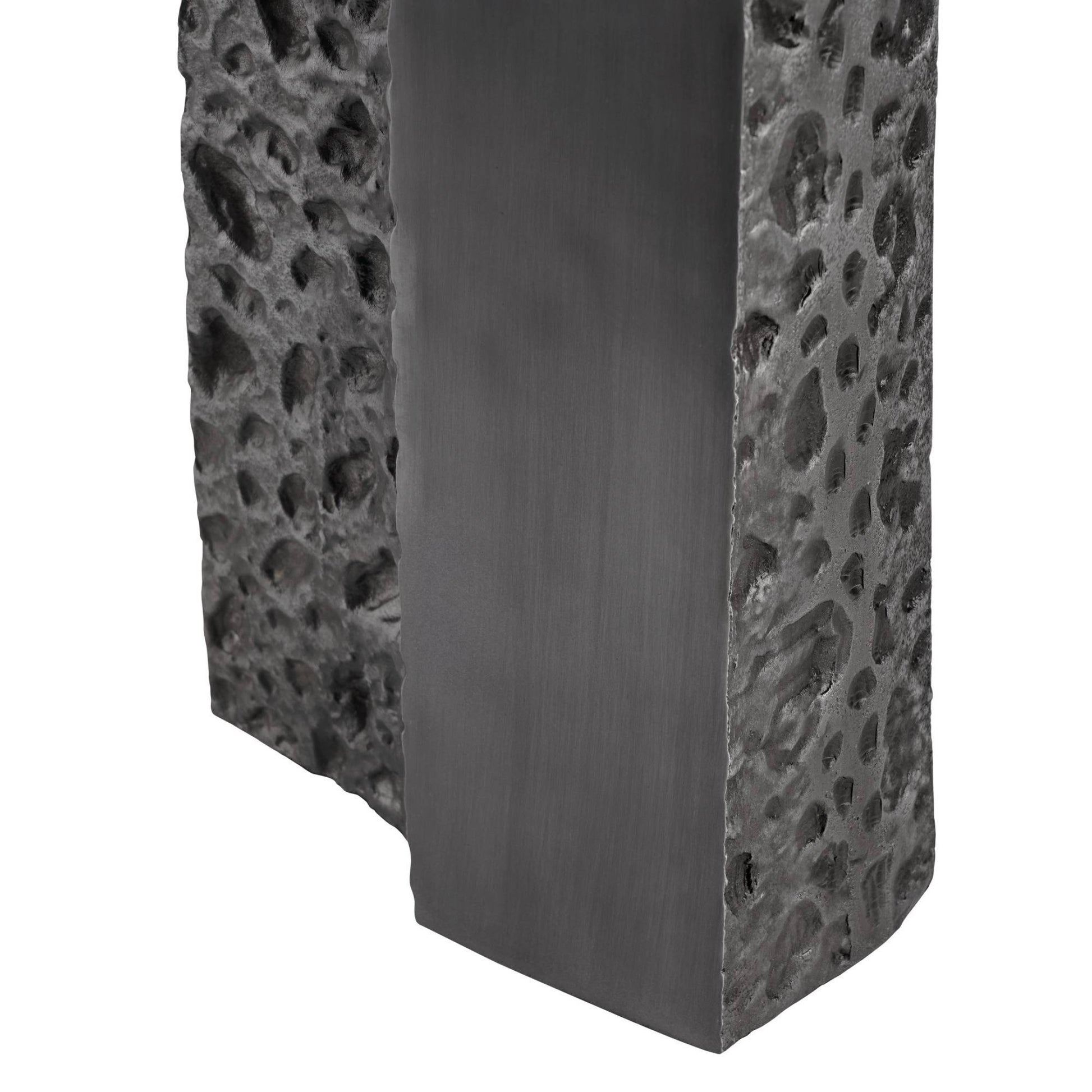 Textured black stone block with a white background