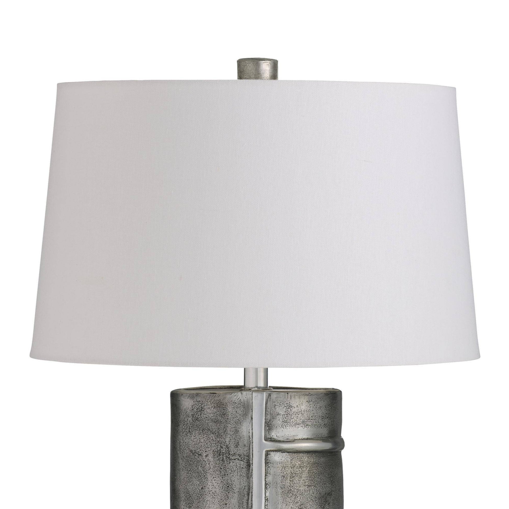 Table lamp with a white shade and metallic base on a white background