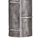 A close-up of a textured gray decorative column or lamp base with a faux stone or brick pattern and horizontal metallic bands, shown against a plain white background.