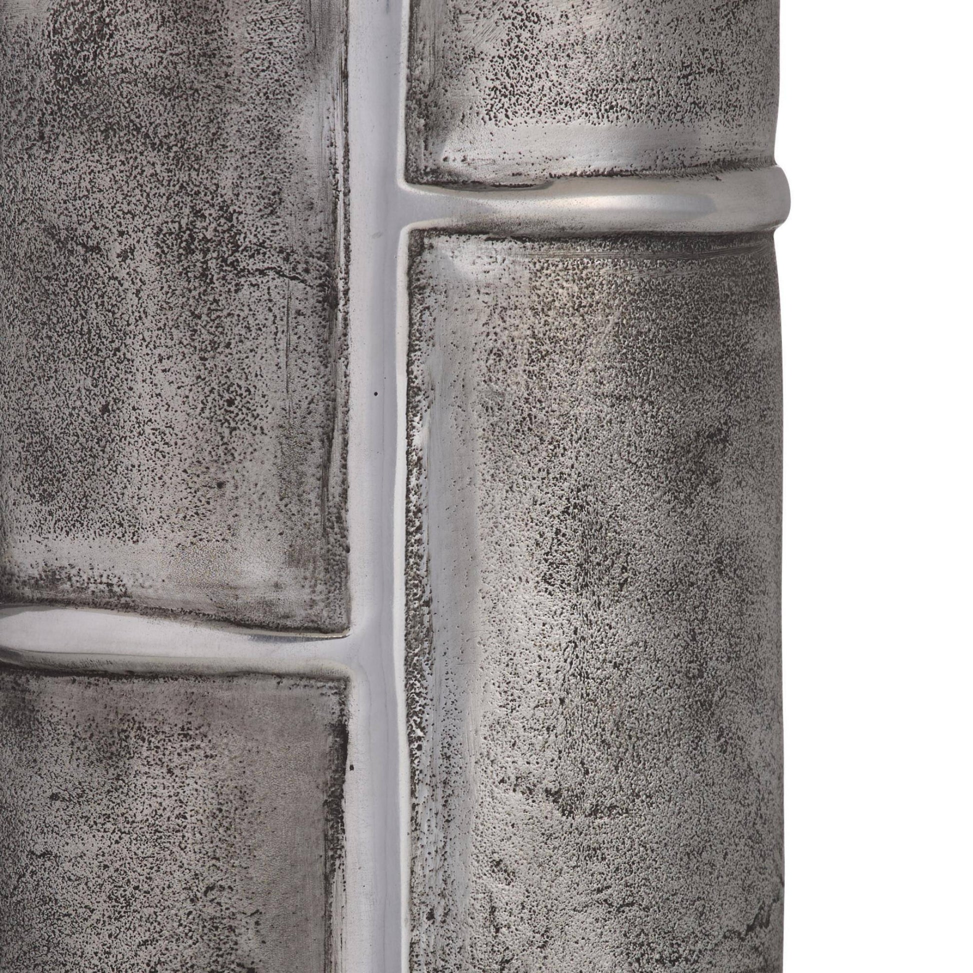 Close-up of textured metal pipes on a white background
