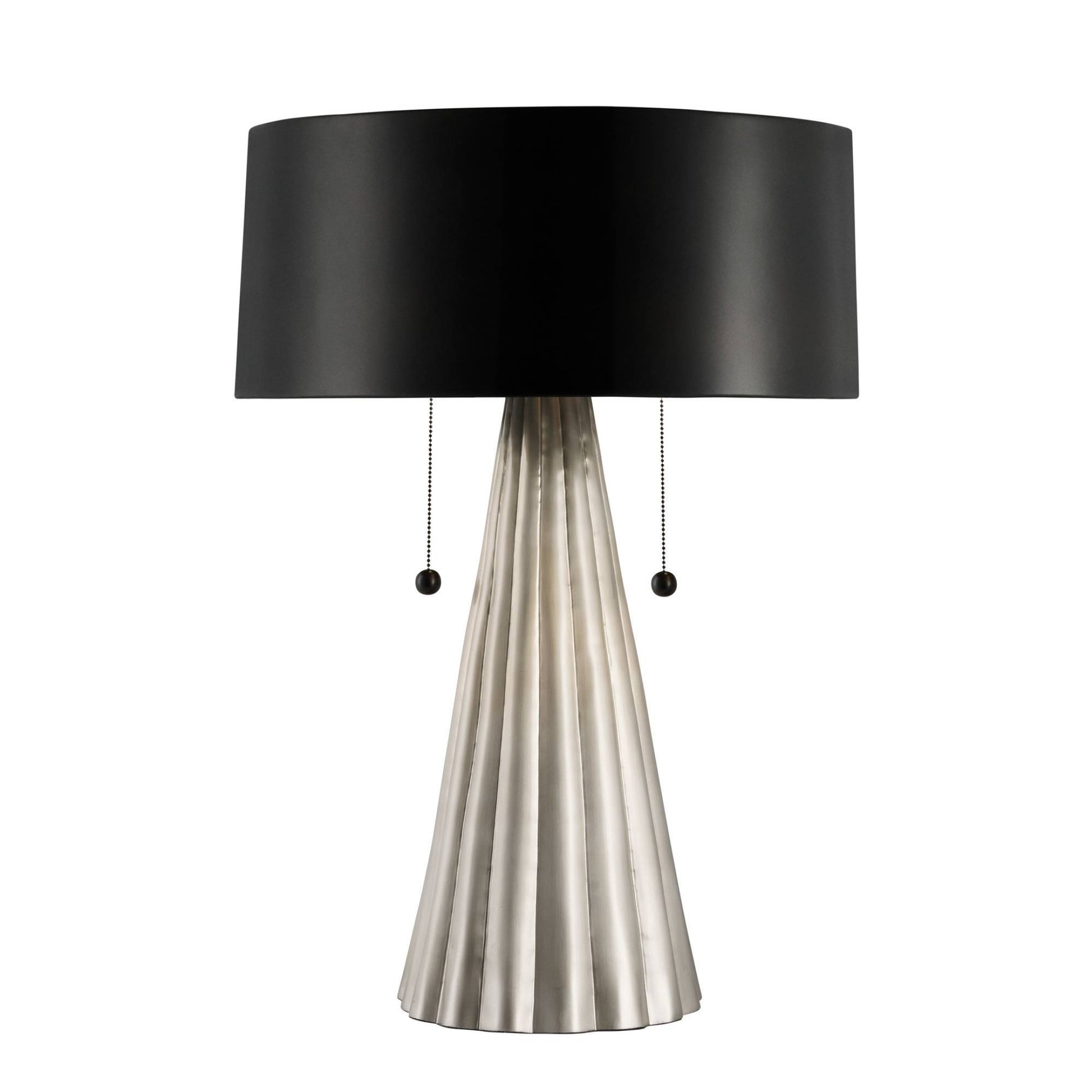 Table lamp with black shade and metallic base on a white background