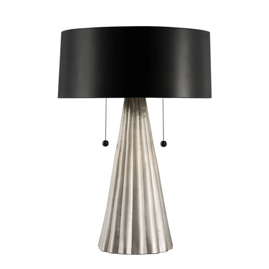 Table lamp with black shade and metallic base on a white background