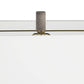 Close-up of a modern white furniture piece with a cylindrical gray textured handle and a thin gold horizontal accent line.