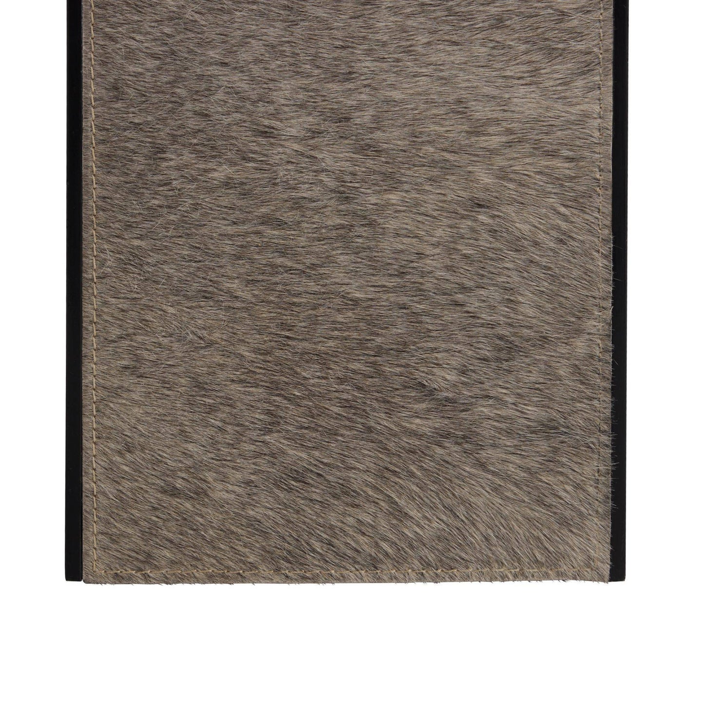 Close-up of a textured brown fabric with a black border