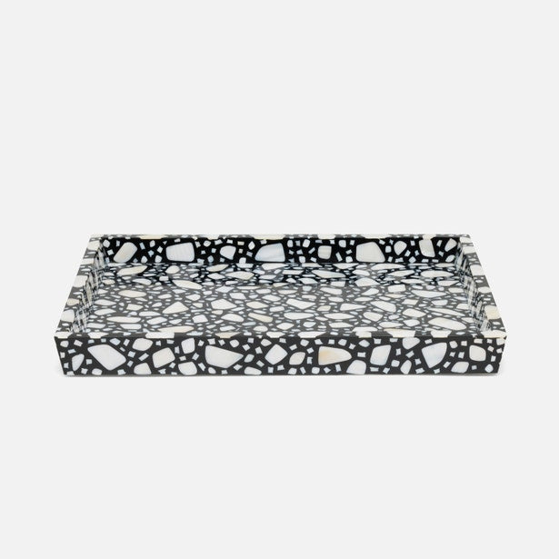 Black and white patterned tray on a light gray background