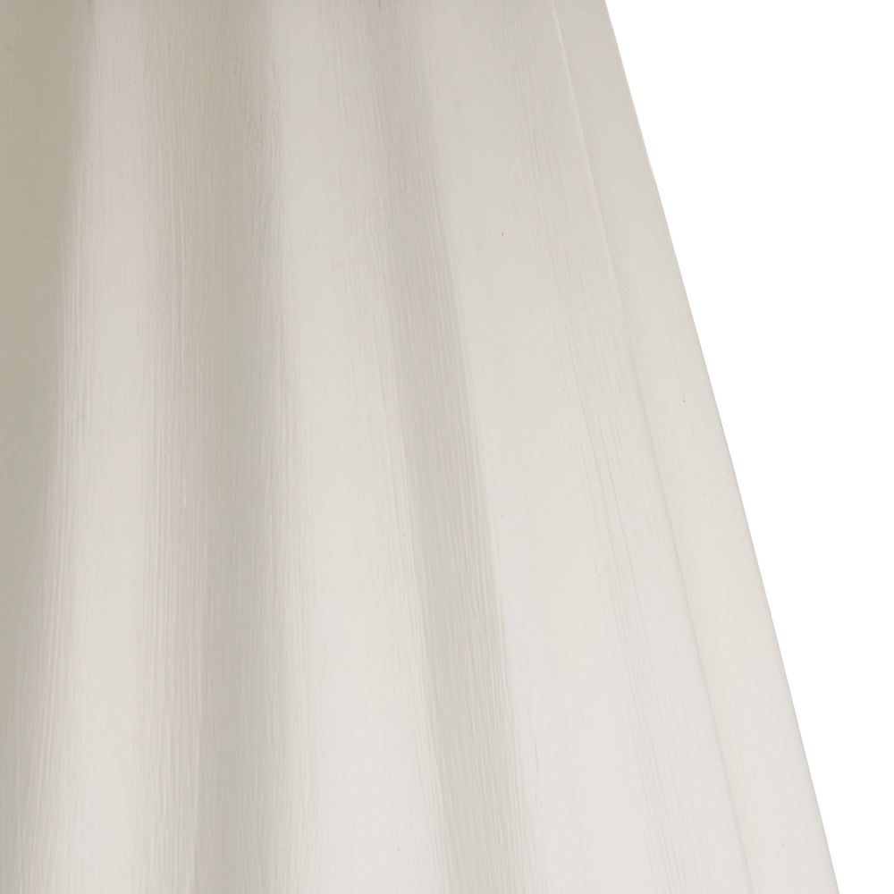 Close-up of a beige curtain with soft folds on a white background