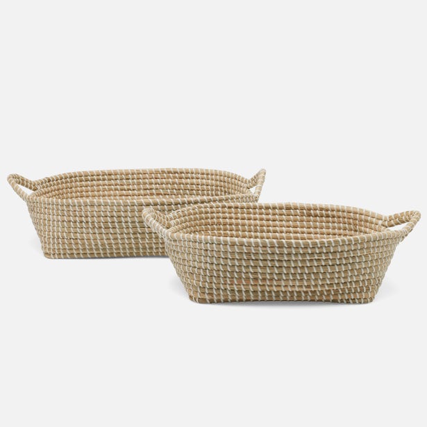 Two woven baskets on a white background