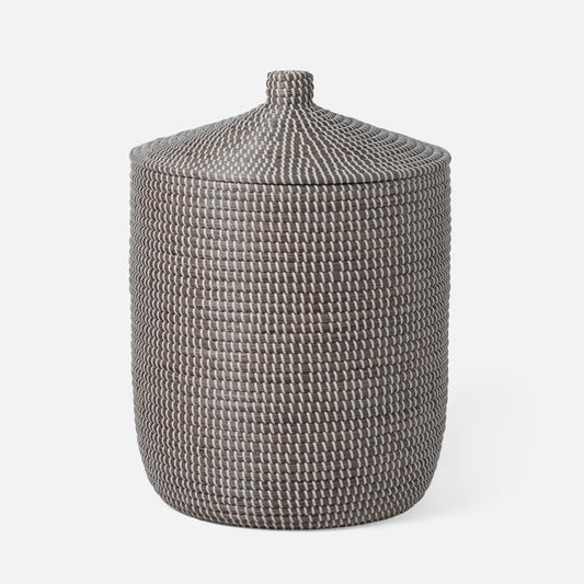 Textured woven basket with a lid on a white background